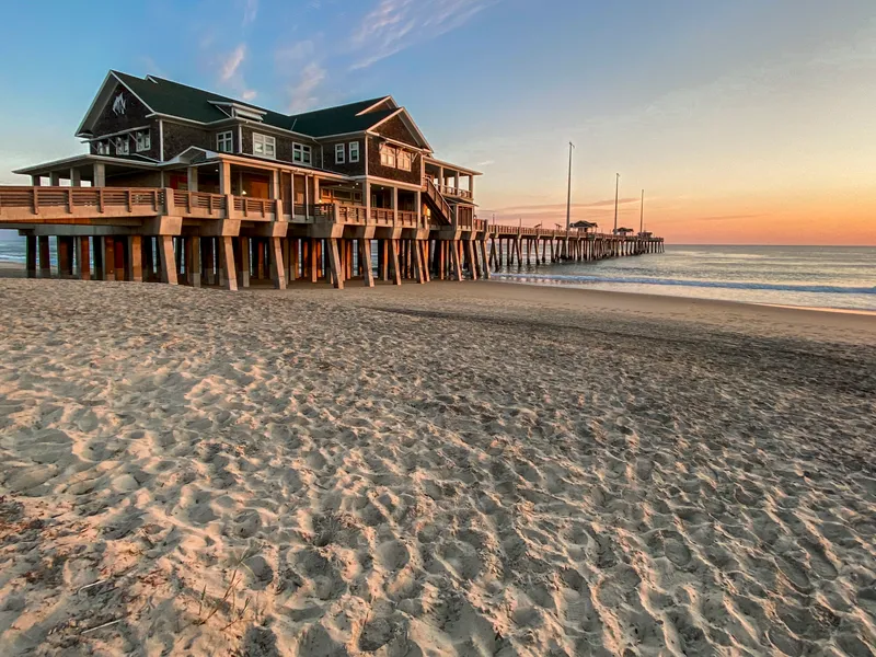Jennettes Pier in Nags Head extending over the ocean with dramatic sky