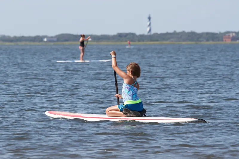 Kayakers paddling on the calm waters of Pamlico Sound along the sound side of Cape Hatteras National Seashore